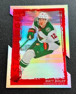 lot 131A image: Matt Boldy Die Cut Star Surge Insert 2023-24 Upper Deck #SS-20 Minnesota Wild Hockey Card