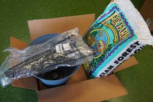 lot 244 image: Fox Farm Potting Soil, Trellis Stakes, and Pot