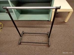 lot 99 image: Plastic Lightweight Rolling Clothes Rack