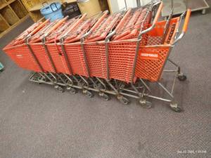 lot 115 image: Row of (7) Red Plastic Shopping Carts