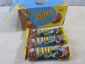 lot 219 image: (B-1) Box of 24 Flipz Pretzels & Caramel Clusters Past Date