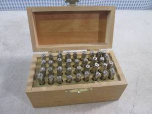 lot 31 image: (EC1) 36pc Number & Capital Letter Punch Set in Wood Organizer Box