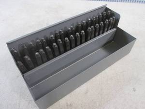 lot 32 image: (CS) 36pc Number & Capital Letter Punch Set in Metal Organizer Case