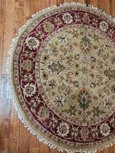 lot 87 image: Round Wool Knotted Oriental Area Rug