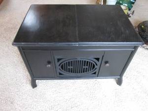 lot 18 image: Brunswick dark tone wood coffee table style cabinet with one side of surface lifting to reveal a unique space for storage
