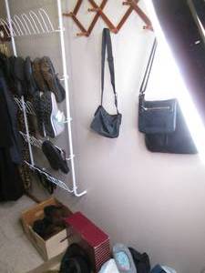 lot 42 image: Assortment of Womens size 9 footwear including a variety of sandals, slippers, casual shoes and boots PLUS bed linens, socks, fancy hats, belts, purses and more