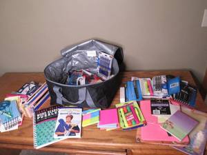 lot 58 image: Insulated travel bag full of post-its, writing implements lots of other office supplies