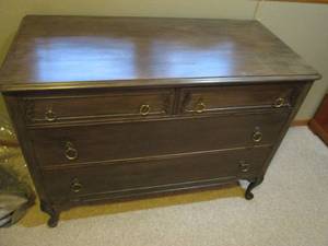 lot 69 image: Vintage Wood Clawfoot style dresser with antique brass hardware, 2-long drawers and 2-smaller Drawer just above them. Measures approximately 482236