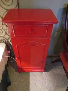 lot 73 image: Bright Wood painted Burnt Orange Tone night stand featuring a single drawer and Cupboard style door that opens to reveal two tiers of storage space. Measures approximately 221132