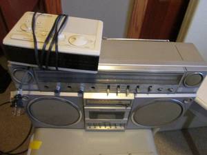lot 63 image: Vintage Panasonic AMFM Cassette tape boombox with a Vintage Dream Machine AMFM Digital clock radio.