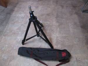 lot 83 image: Very heavy adjustable tripod that tucks nicely into its over the shoulder travel bag