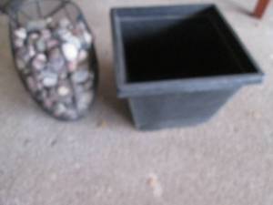 lot 120 image: Metal basket filled with rocks and a plastic planter