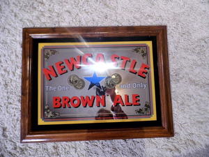 lot 200 image: New Castle Brown Ale Mirrored back framed advertisement