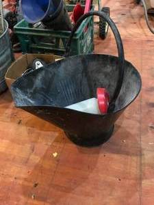 lot 424 image: Lot of seed spreader, large bolts, Echo blower, backet of motor oil, measuring T and water jug.