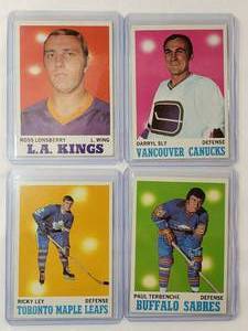 lot 180 image: Lot of 4 Vintage 1970-71 NHL Topps Paul Terbenche No. 123, Darryl Sly No. 115, Rickey Ley No. 108, Ross Lonsberry No. 37