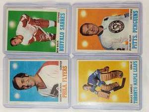 lot 189 image: Lot of 4 NHL 1970-71 Bruce Gamble No. 105, Andre Lacroix No. 84, Duane Rupp No. 89, Bob Baun No. 24