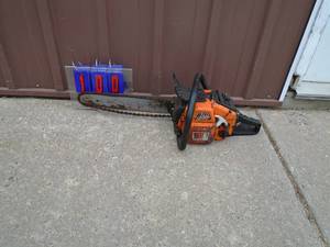 lot 100 image: Olympic 16 chainsaw. Used condition. Ran on ether. As shown.