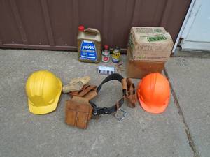 lot 104 image: Hard hats, nail belt, antifreeze & 2 open boxes of nails. As shown.