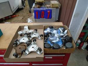 lot 107 image: 2 flats of casters. As shown.