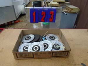 lot 123 image: Flat of angle grinder wheels. As shown.