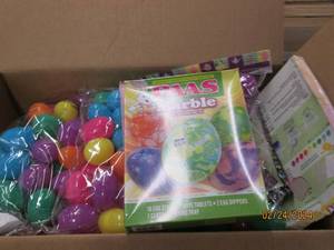 box of easter eggs and egg decorating kits and easter grass