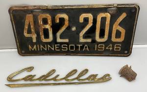 lot 53 image: 1950s Gold Plated Cadillac Grille Script (Missing Pegs), Cadillac Emblem & 1946 Minnesota License Plate