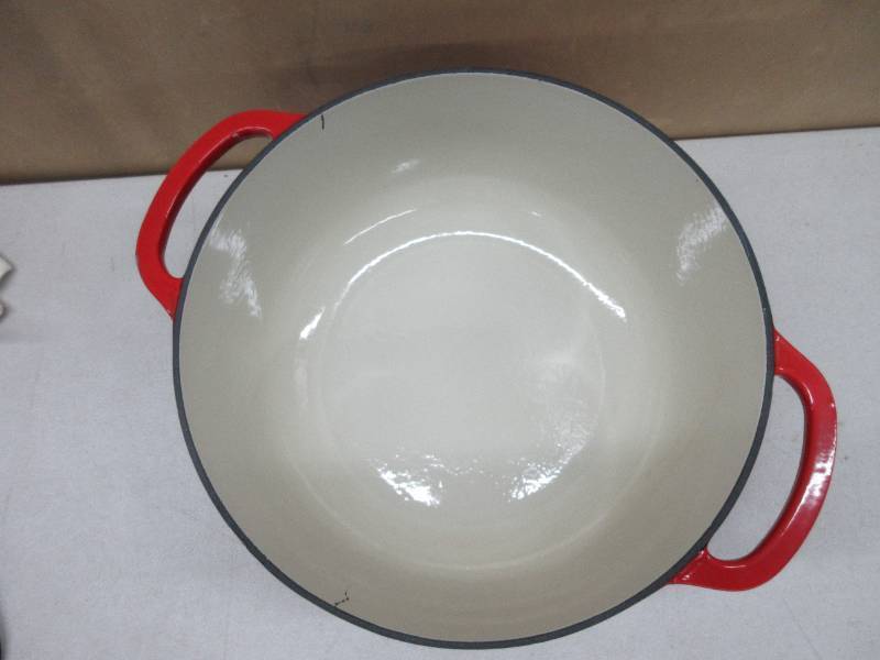 lot 223 image: Lodge 7.5 Quart Enameled Cast Iron Dutch Oven with Lid  Dual Handles  Oven Safe up to 500° F or on Stovetop - Use to Marinate, Cook, Bake, Refrigerate and Serve  Island Spice Red ENAMEL DAMAGED (see pictures for details)