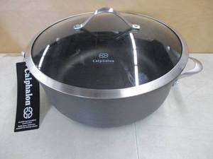 lot 702 image: Calphalon Contemporary Nonstick 8.5 Qt. Dutch Oven With Lid - Slightly Dented - Still in nice condition.
