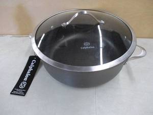 lot 703 image: Calphalon Contemporary Nonstick 8.5 Qt. Dutch Oven With Lid - Slightly Dented - Still in nice condition.