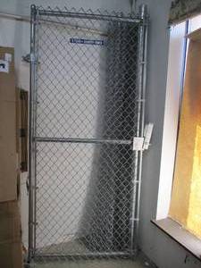 lot 725 image: Chain Link Fencing (8x8), 2 Posts With Bases and Cross Beam. Nuts and Bolts, Includes 8x42 Gate With Latch. - Used in warehouse. SOLD AS IS