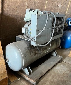 Industrial air compressor with a Baldor be a LDOR industrial motor 209 V conditioner