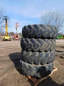 lot 21 image: 4 - Firestone Foam Filled Rough Terrain Telehandler Tires with Rims - 14.00-24TG