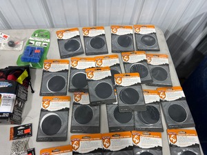 TABLE FULL OF GROMMETS, BUNGEES, & PATCHES