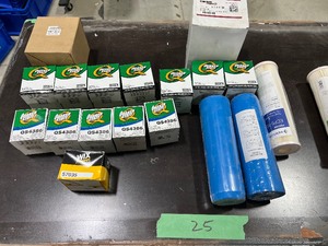 TABLE FULL OF AIR FILTERS & OIL FILTERS