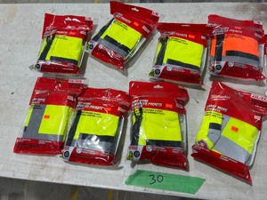 TABLE FULL OF SAFETY VESTS