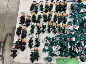 TABLE FULL OF GARDEN HOSE FITTINGS