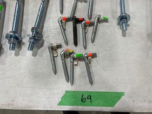 TABLE FULL OF BOLT HOOKS