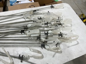 TABLE FULL OF READY ROD HANGERS & I-BOLTS