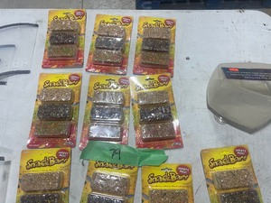 TABLE FULLL OF HAMSTER FOOD, BIRD FEEDER, & DOG PROTECTIVE COLLAR