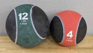 lot 115A image: First Place Elite Bouncing Medicine Balls (1) 12 Lb. and (1) 4 Lb. B