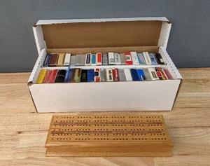 lot 99 image: Cribbage Board and 40 Sets of Playing Cards E