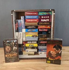 lot 104 image: Vintage Collection of VHS Tapes Gone with the Wind, 007, Sixteen Candles, Weekend at Bernies and Many More E
