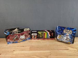 lot 133 image: Star Wars Hot Wheels, Micro-Machine, and Disney Starships Toys and Glow in the Dark Poster E