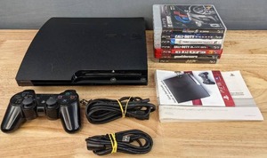 lot 1A image: Playstation 3 with Accessories and (7) Games Call of Duty, Red Dead Redemption, Grand Theft Auto, and More  E