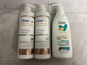 lot 211 image: 2 Dove Hair Therapy Conditioner and Body Lotion