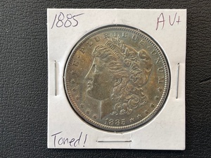 lot 57 image: 1885 Morgan Dollar Toned AU