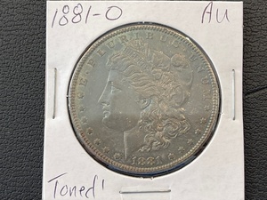 lot 60 image: 1881-O Morgan Dollar Toned AU