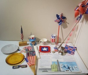 lot 76 image: Nice Collection of Americana Fourth of July 4th Including Indiana Glass Co. Amber Liberty Bell Plate, Vintage Plastic Placemat  The Presidents of the USA Thru Clinton 1993