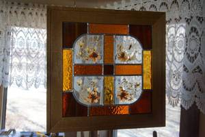 lot 16 image: Stained Glass Window Art Signed By Artist June Gray Natural Dried Flowers Butterfly Amber Glass Cross