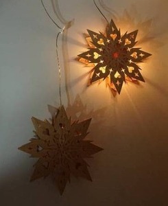 lot 34 image: Made in Sweden 12-Inch Die-Cut Star Snowflake Heart Wall-Mount Hanging Lights